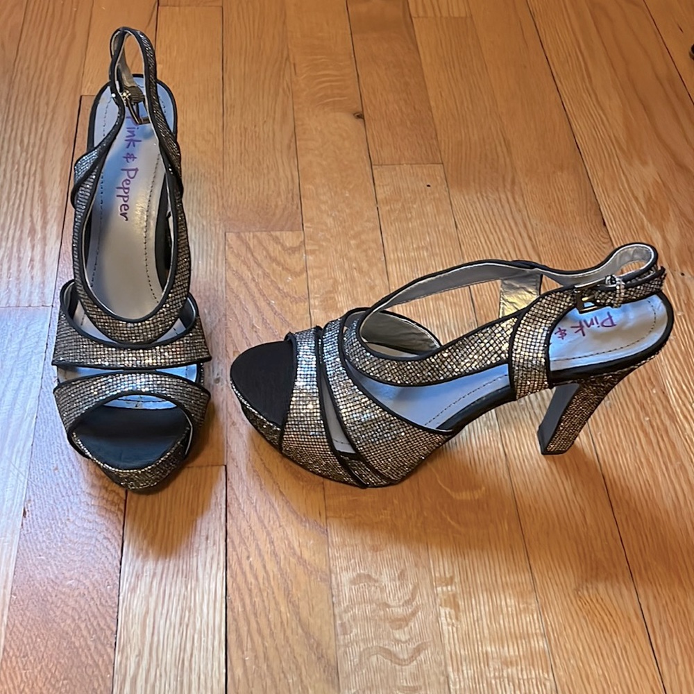 Never worn black and silver heels